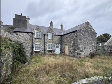 Grade II listed house with outbuildings & land